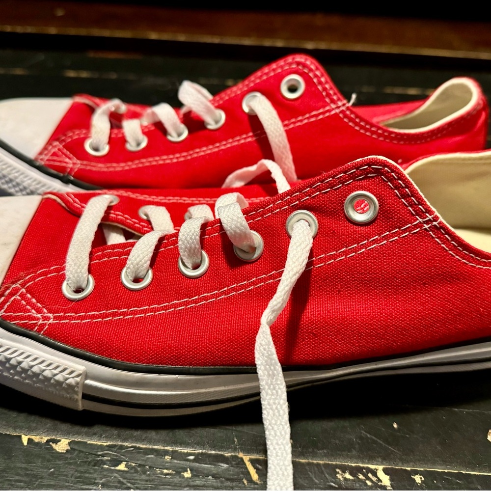 Size 10 women candy apple red Chucks.